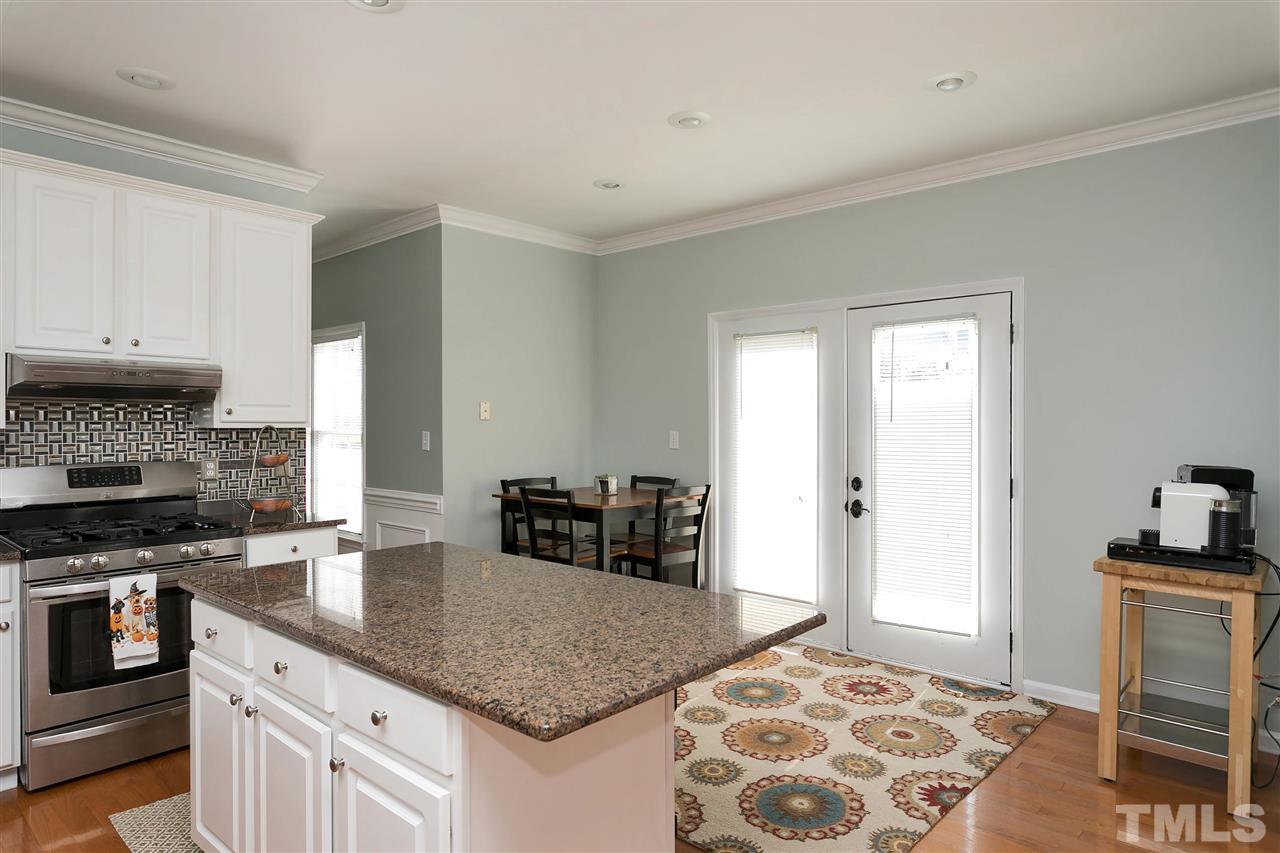 2337 Bolingbrook Lane Raleigh, NC 27613 - Photo 6 of 25 a kitchen with stainless steel appliances granite countertop a stove and a sink