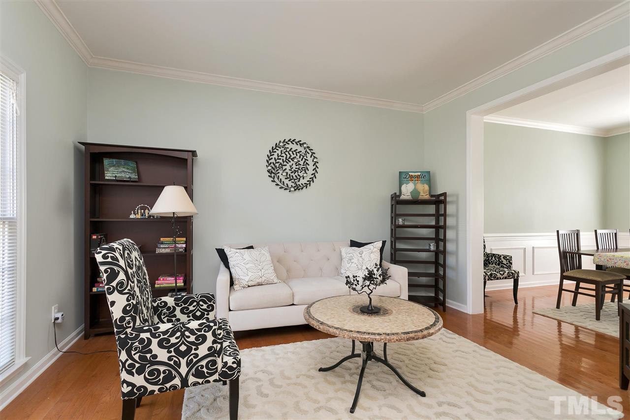 2337 Bolingbrook Lane Raleigh, NC 27613 - Photo 9 of 25 a living room with furniture and wooden floor