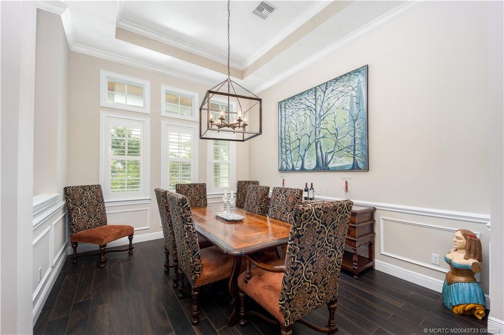 1665 Northwest Fork Road Stuart, FL 34994 - Photo 11 of 52 a view of a dining room with furniture window and wooden floor
