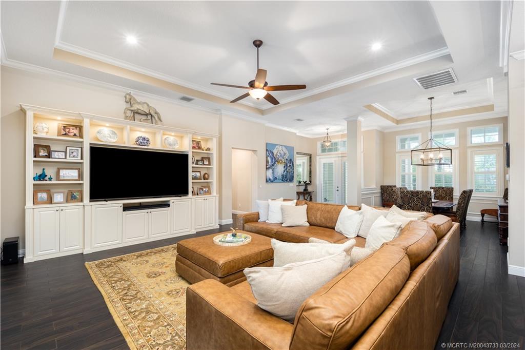 1665 Northwest Fork Road Stuart, FL 34994 - Photo 15 of 52 a living room with furniture and a flat screen tv