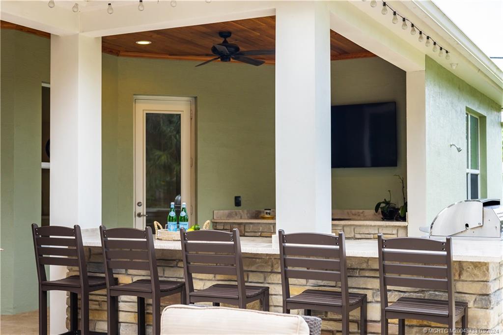 1665 Northwest Fork Road Stuart, FL 34994 - Photo 47 of 52 a building outdoor space with patio furniture