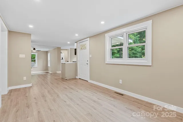 a kitchen that has a sink and a stove in it