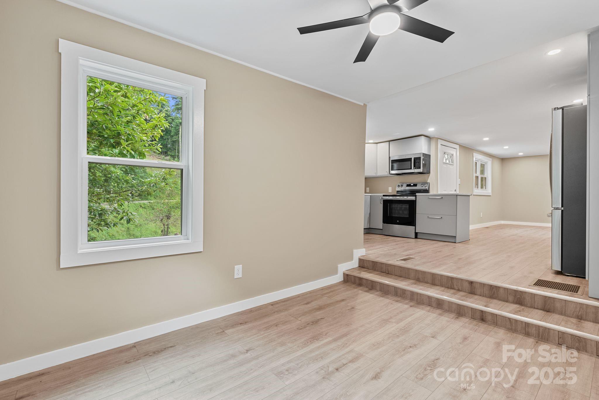 530 Rebel Ridge Road Marshall, NC 28753 - Photo 20 of 46 a view of kitchen with sink and refrigerator