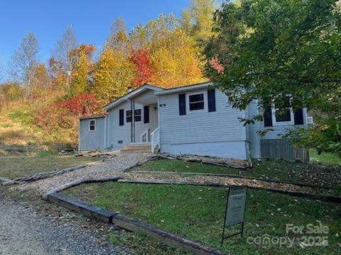 530 Rebel Ridge Road Marshall, NC 28753 - Photo 2 of 46 a view of a house with a yard