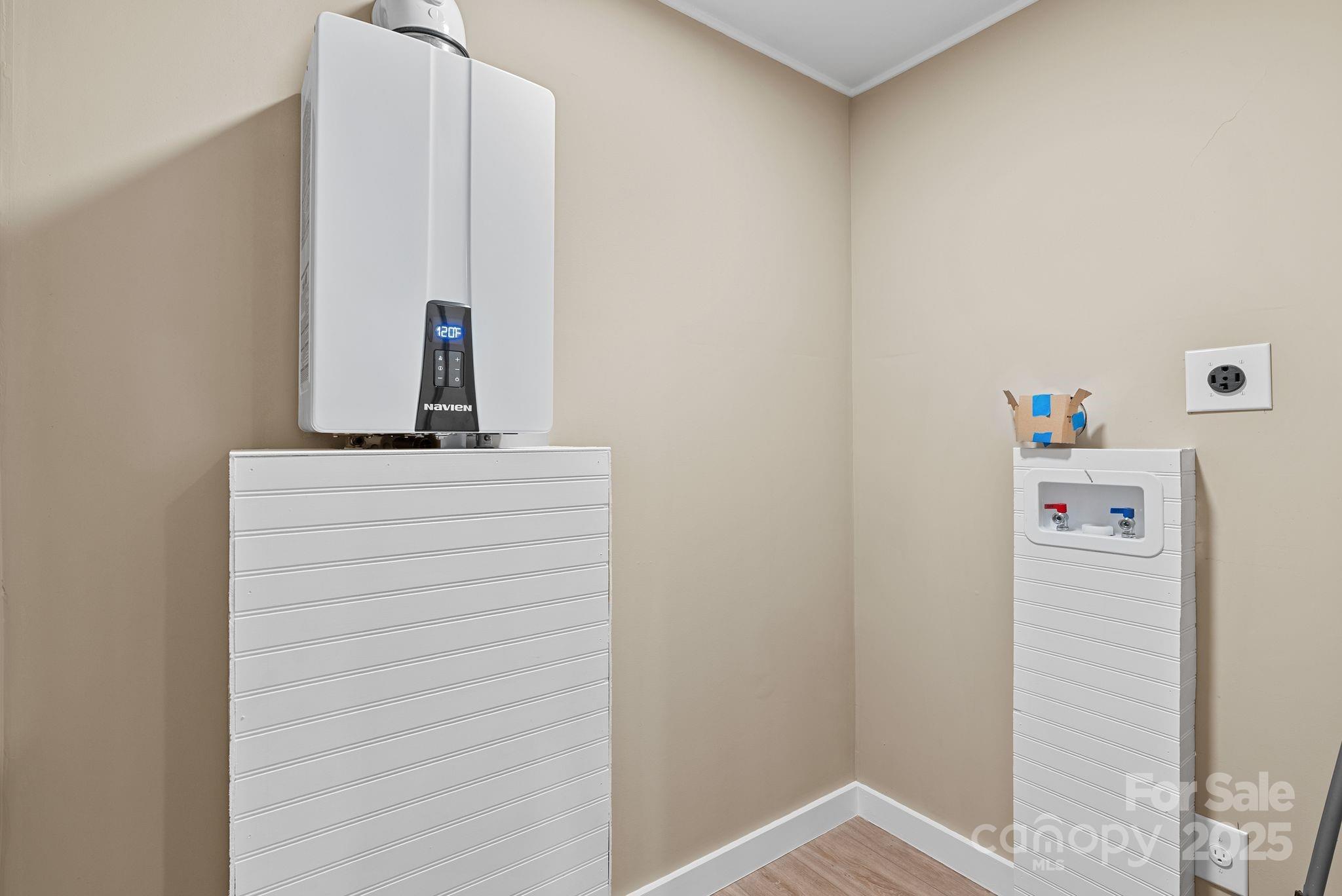 530 Rebel Ridge Road Marshall, NC 28753 - Photo 21 of 46 a bathroom with a sink and a mirror