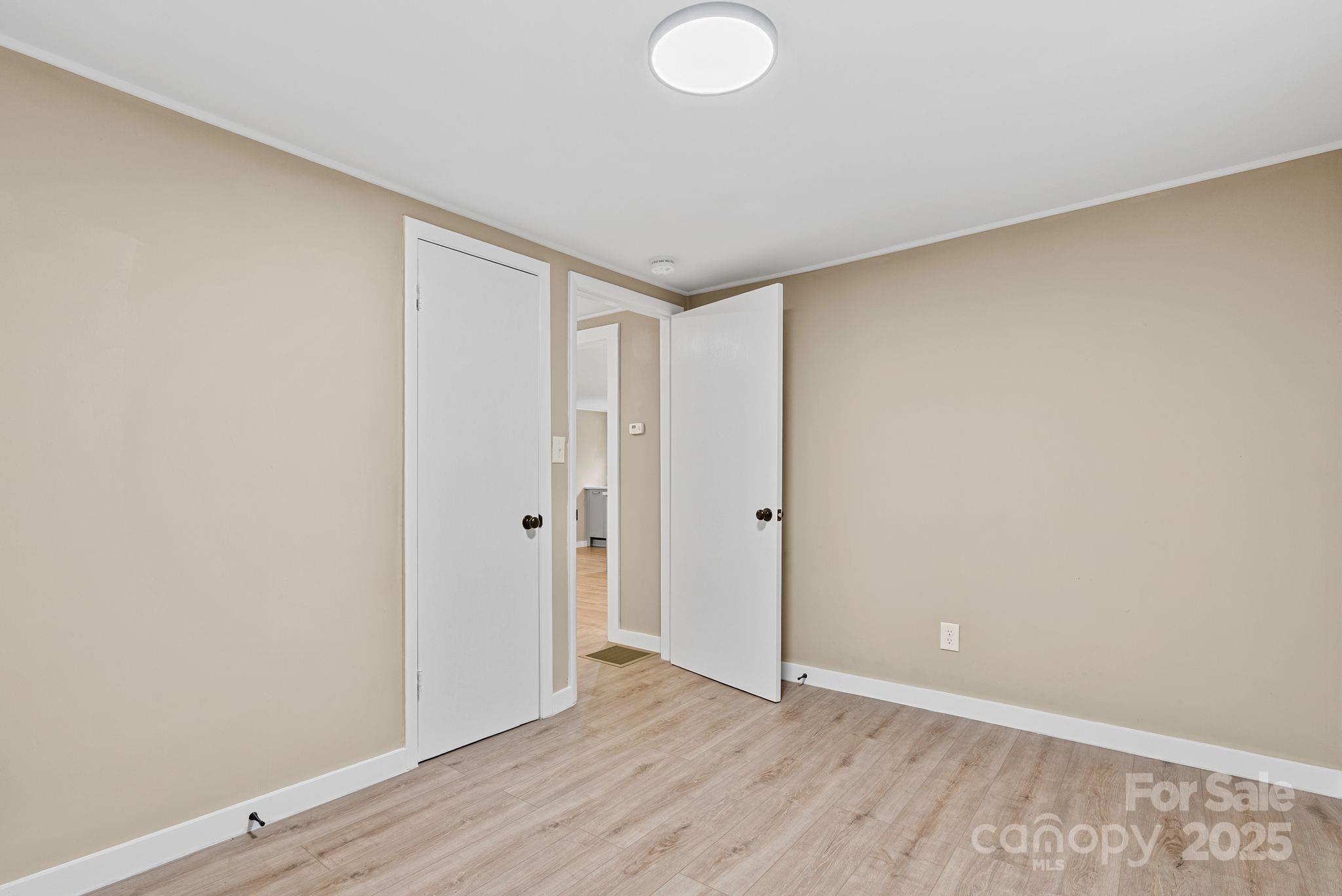 530 Rebel Ridge Road Marshall, NC 28753 - Photo 23 of 46 a view of hallway with wooden floor