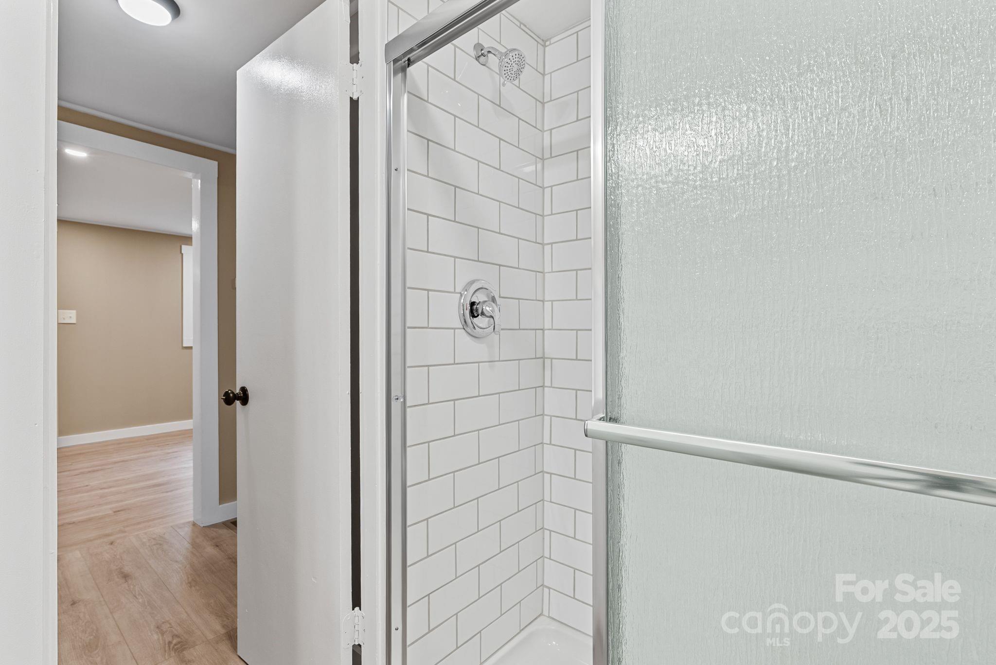 530 Rebel Ridge Road Marshall, NC 28753 - Photo 27 of 46 a bathroom with a shower