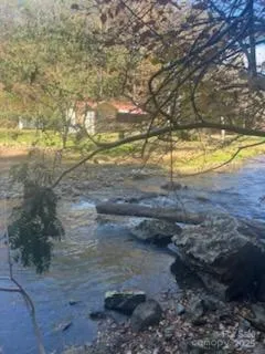 a house view with a sitting space and a view of a house