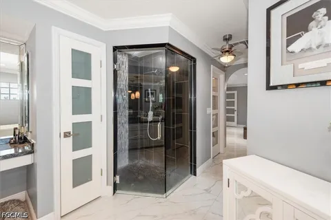 a bathroom with a tub and shower