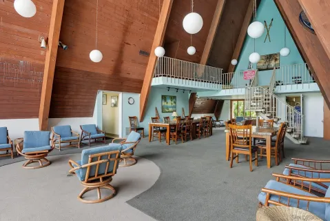 a view of a livingroom with furniture and a window