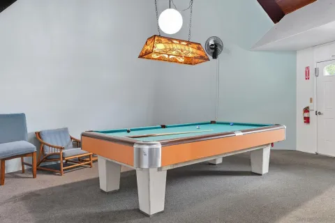 a room with table and chairs