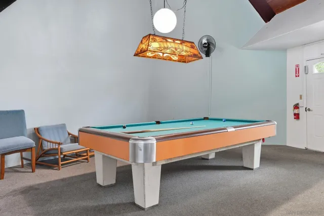 a room with table and chairs