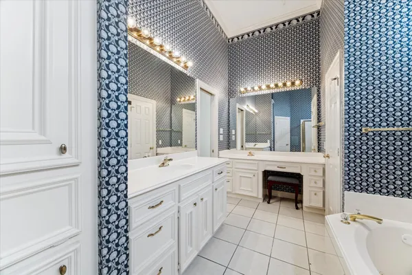 a spacious bathroom with a double vanity sink mirror and