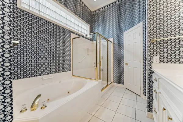 a bathroom with a bathtub and shower