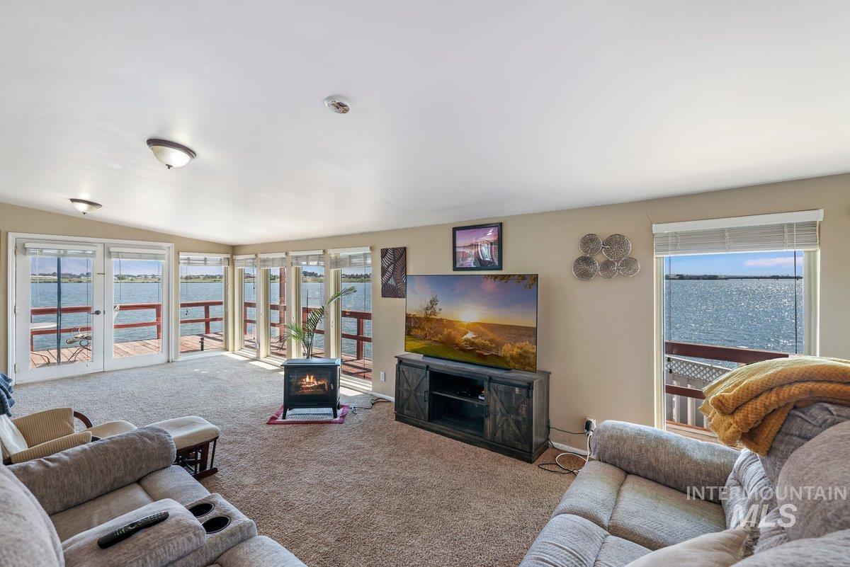 1801 Y Street Heyburn, ID 83336 - Photo 16 of 42 Carpeted living room featuring a fireplace
