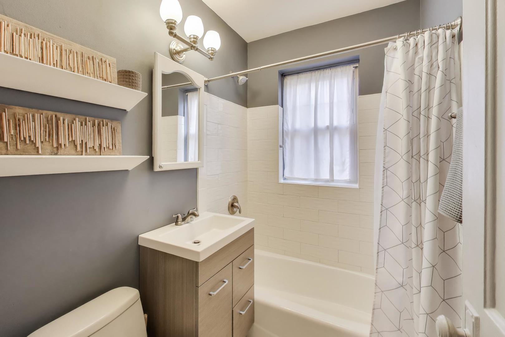 108 Lincoln Avenue, Unit 2B Riverside, IL 60546 - Photo 13 of 18 a bathroom with a sink a toilet and shower