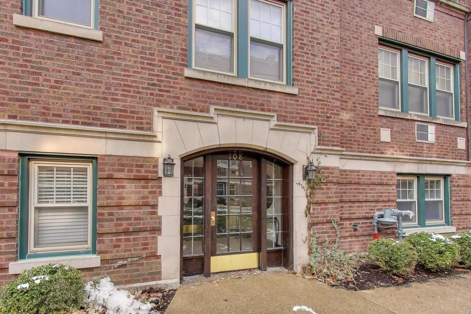 108 Lincoln Avenue, Unit 2B Riverside, IL 60546 - Photo 3 of 18 a front view of a building with a window