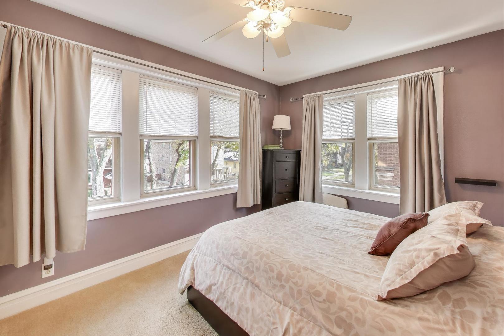 108 Lincoln Avenue, Unit 2B Riverside, IL 60546 - Photo 10 of 18 a bedroom with a large bed and a large window