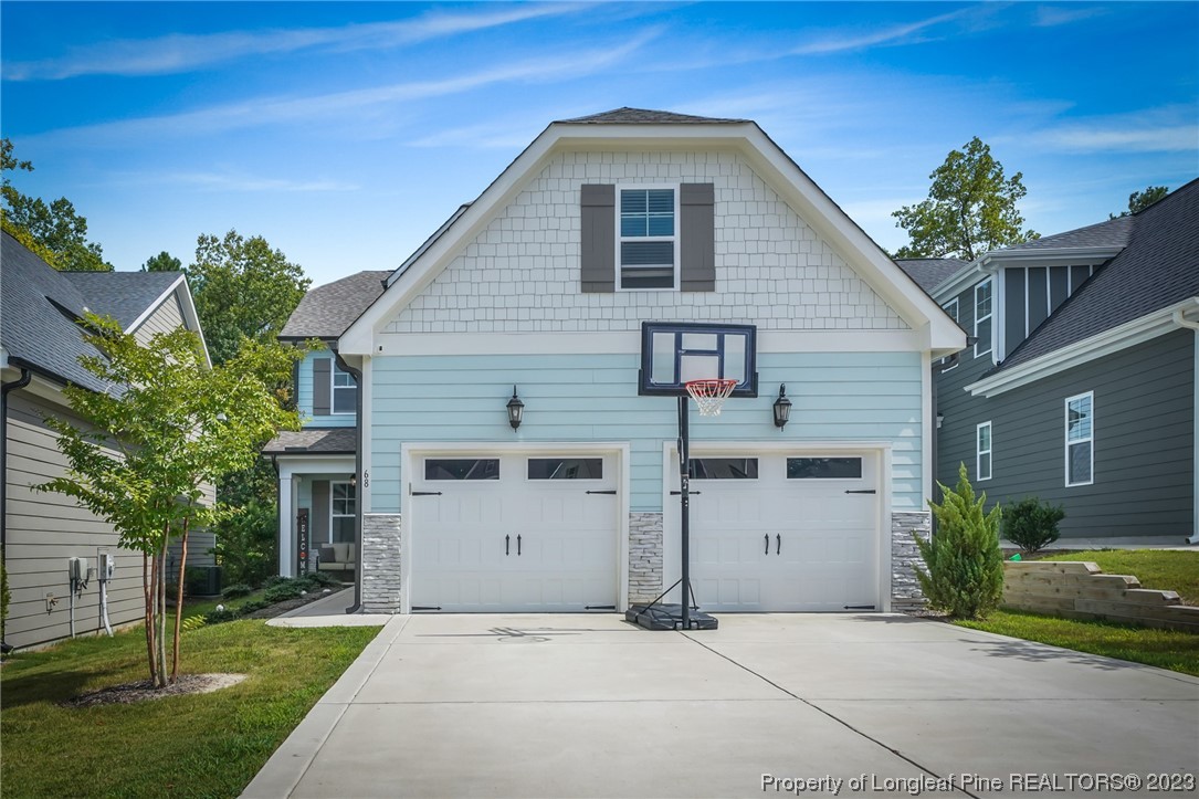 68 Spruce Hollow Circle Spring Lake, NC 28390 - Photo 1 of 48 a front view of a house with a yard