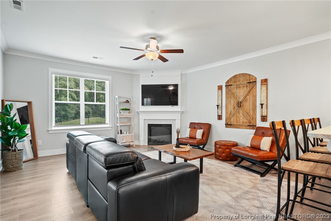 68 Spruce Hollow Circle Spring Lake, NC 28390 - Photo 13 of 48 a living room with furniture fireplace and window
