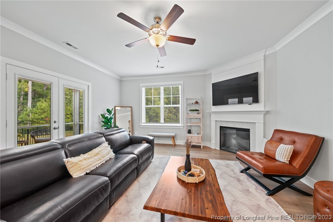 68 Spruce Hollow Circle Spring Lake, NC 28390 - Photo 14 of 48 a living room with furniture fireplace and a large window