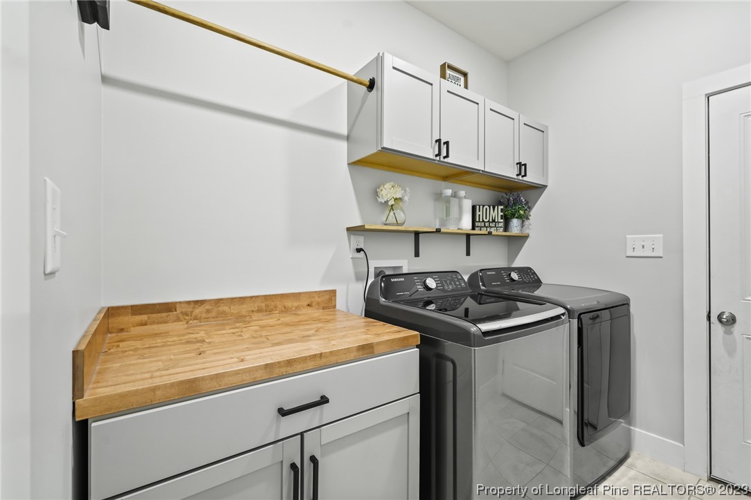 68 Spruce Hollow Circle Spring Lake, NC 28390 - Photo 16 of 48 a kitchen with stainless steel appliances granite countertop a sink and a stove