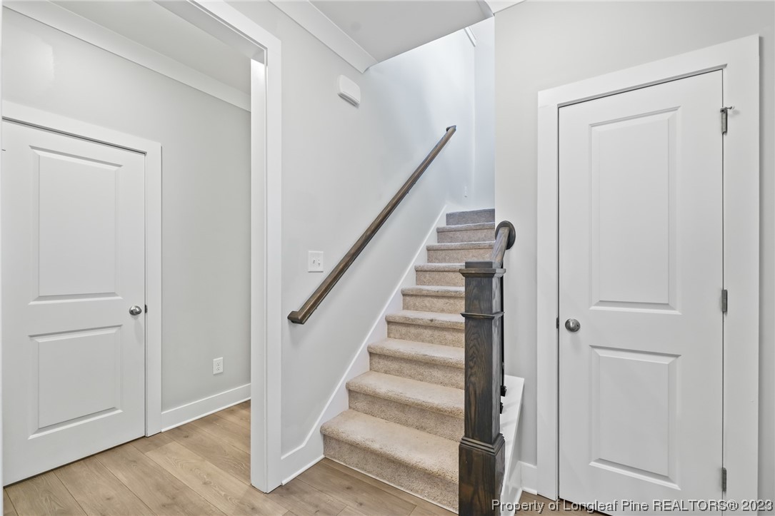 68 Spruce Hollow Circle Spring Lake, NC 28390 - Photo 20 of 48 a view of a hallway with wooden floor and entryway
