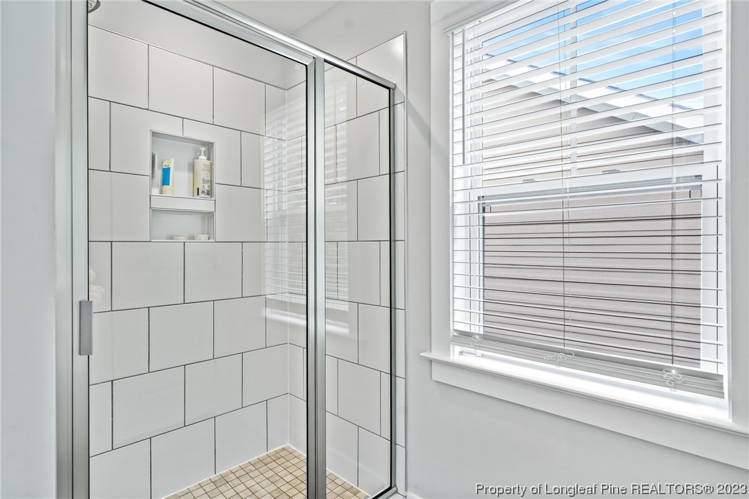 68 Spruce Hollow Circle Spring Lake, NC 28390 - Photo 30 of 48 a bathroom with a shower