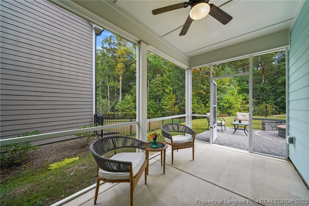 68 Spruce Hollow Circle Spring Lake, NC 28390 - Photo 41 of 48 a balcony with furniture and large windows