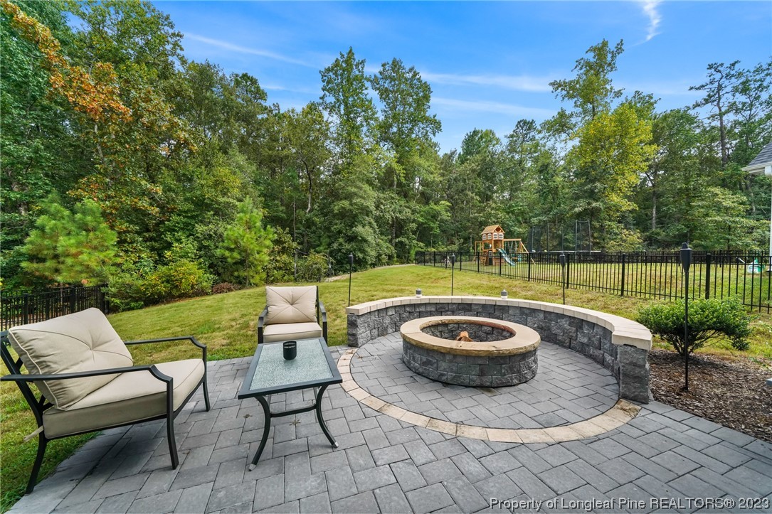 68 Spruce Hollow Circle Spring Lake, NC 28390 - Photo 42 of 48 a view of a backyard with swimming pool and furniture