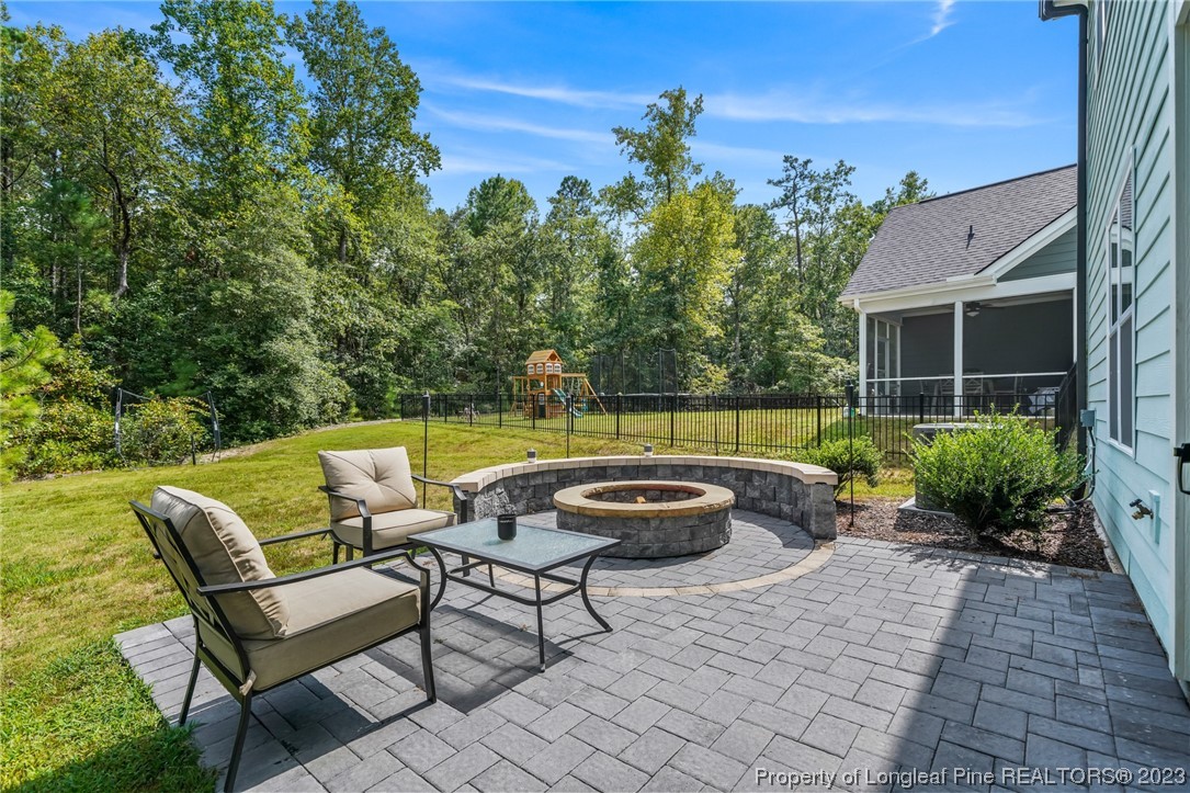 68 Spruce Hollow Circle Spring Lake, NC 28390 - Photo 43 of 48 a view of a backyard with sitting area