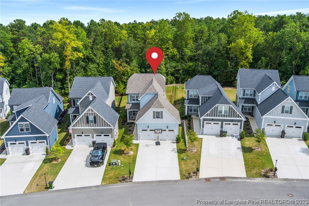 68 Spruce Hollow Circle Spring Lake, NC 28390 - Photo 46 of 48 an aerial view of residential houses with outdoor space and parked