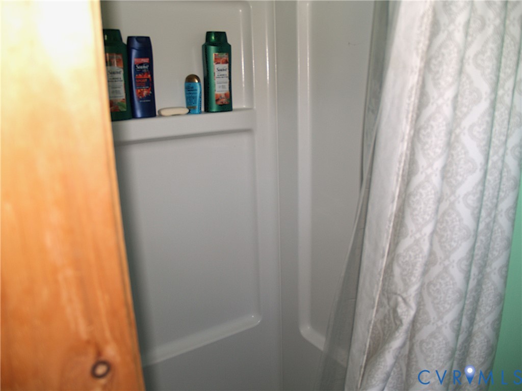 8020 Foxwell Road Providence Forge, VA 23140 - Photo 11 of 15 a bathroom with a sink and a mirror