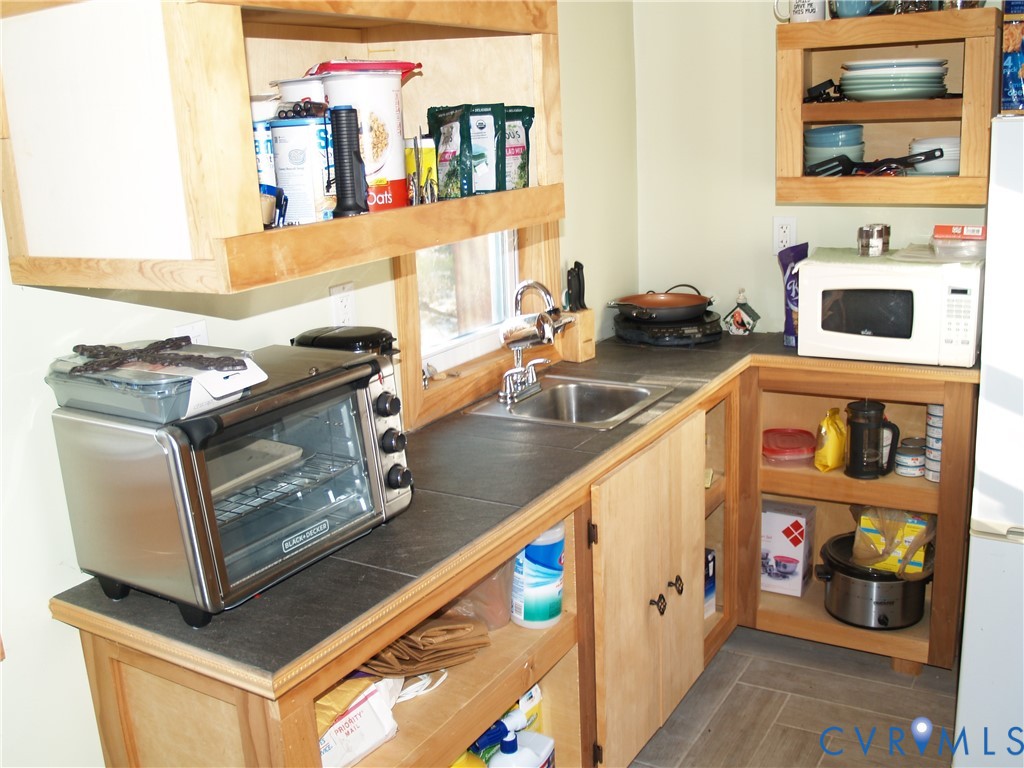 8020 Foxwell Road Providence Forge, VA 23140 - Photo 6 of 15 a kitchen with stainless steel appliances granite countertop a stove and a microwave