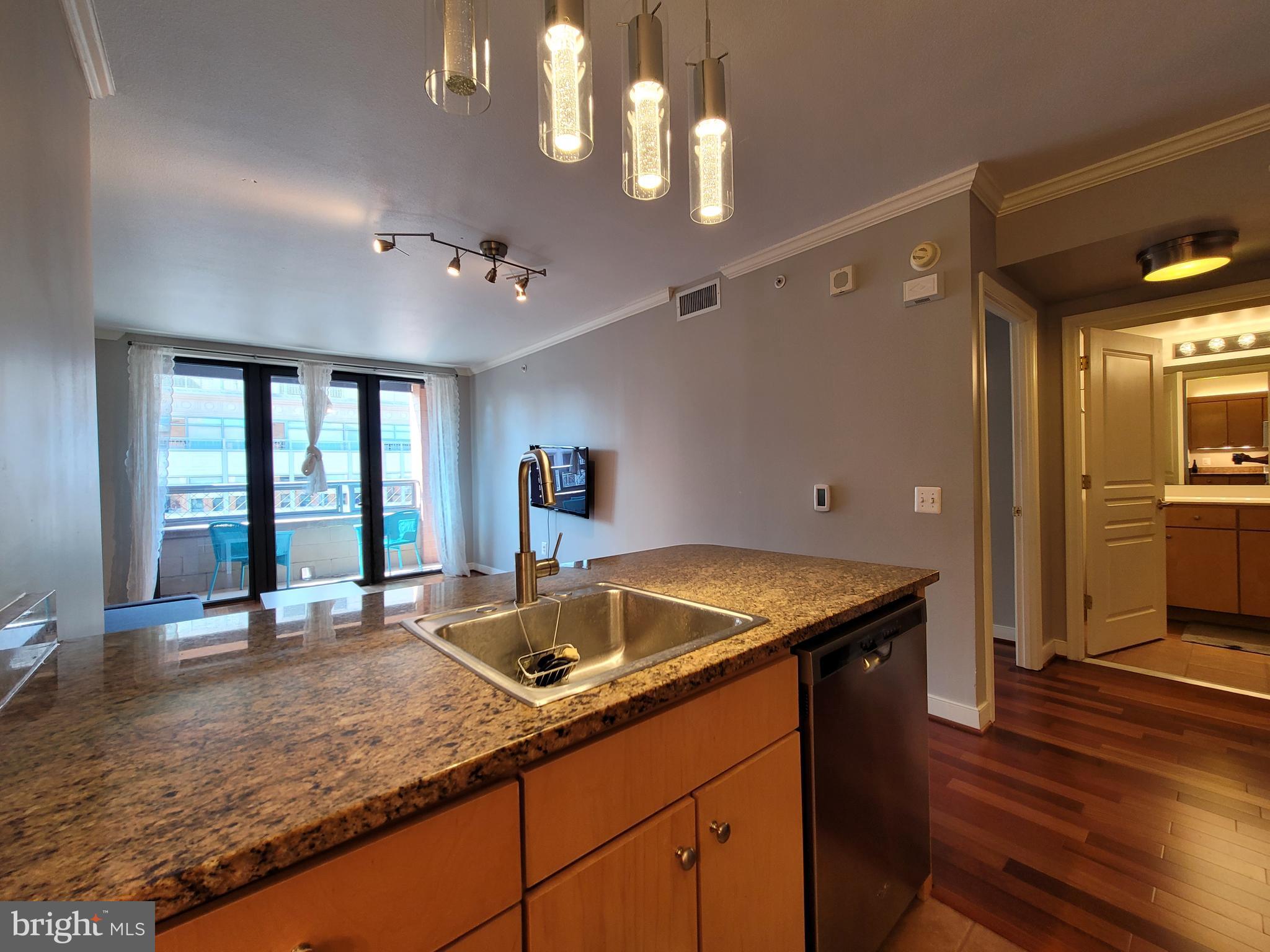 631 D Street Northwest, Unit 1132 Washington, DC 20004 - Photo 12 of 58 a kitchen with a stove and a sink