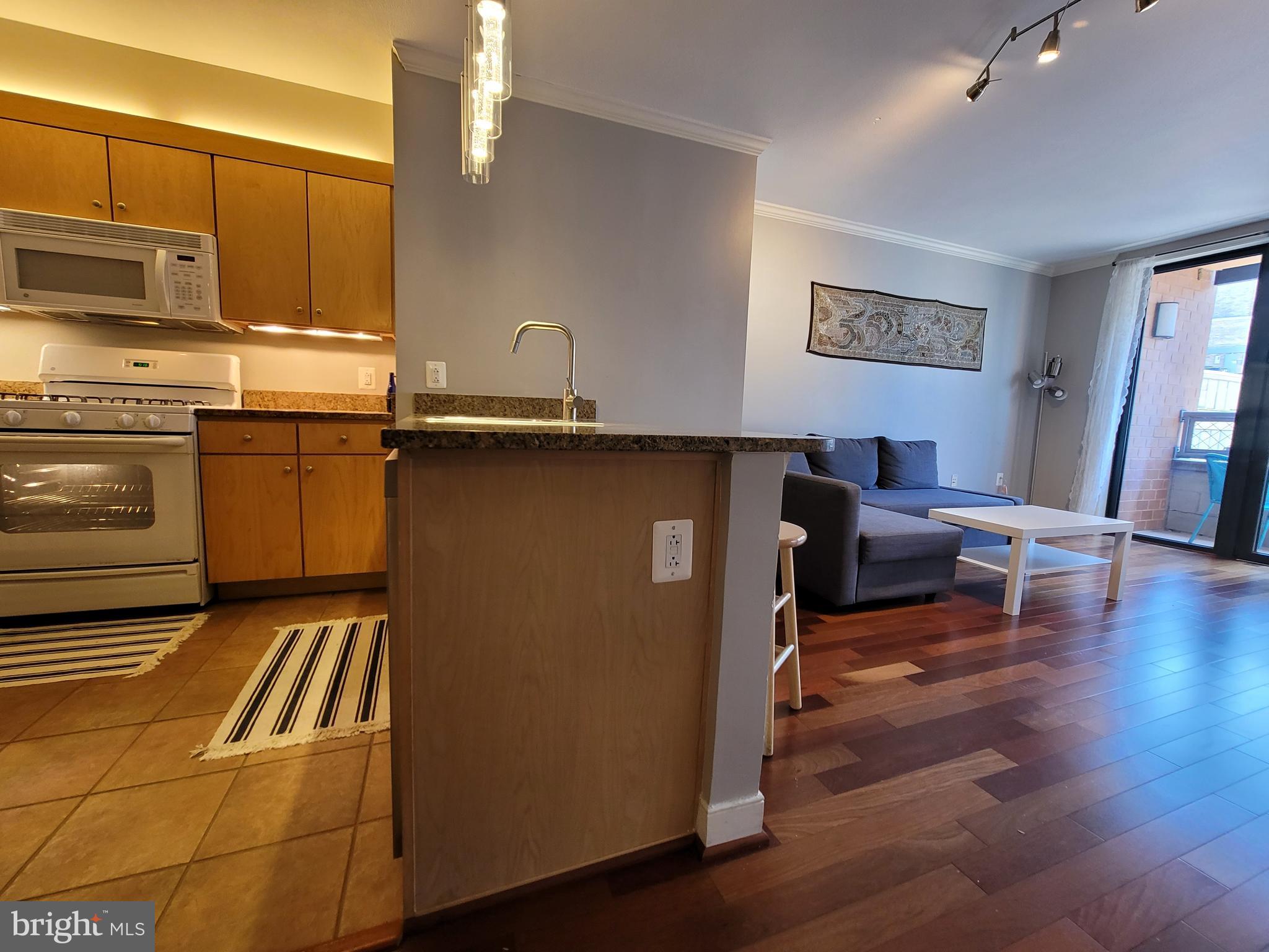 631 D Street Northwest, Unit 1132 Washington, DC 20004 - Photo 14 of 58 a kitchen with a sink appliances and cabinets