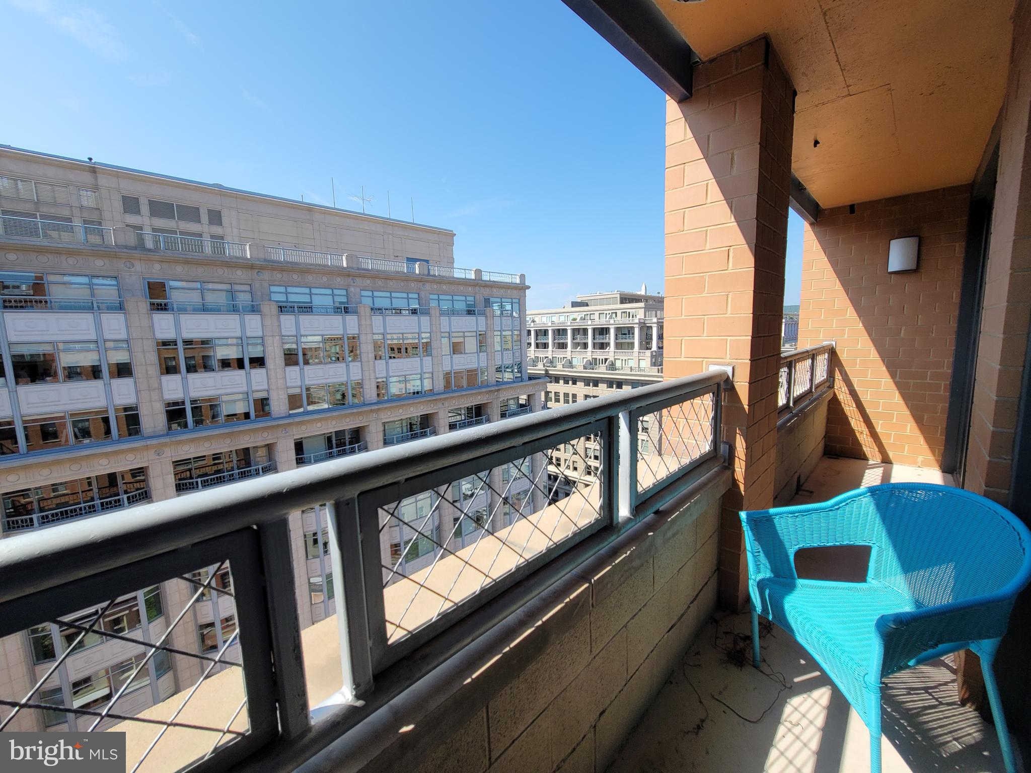 631 D Street Northwest, Unit 1132 Washington, DC 20004 - Photo 2 of 58 a view of a balcony with chairs