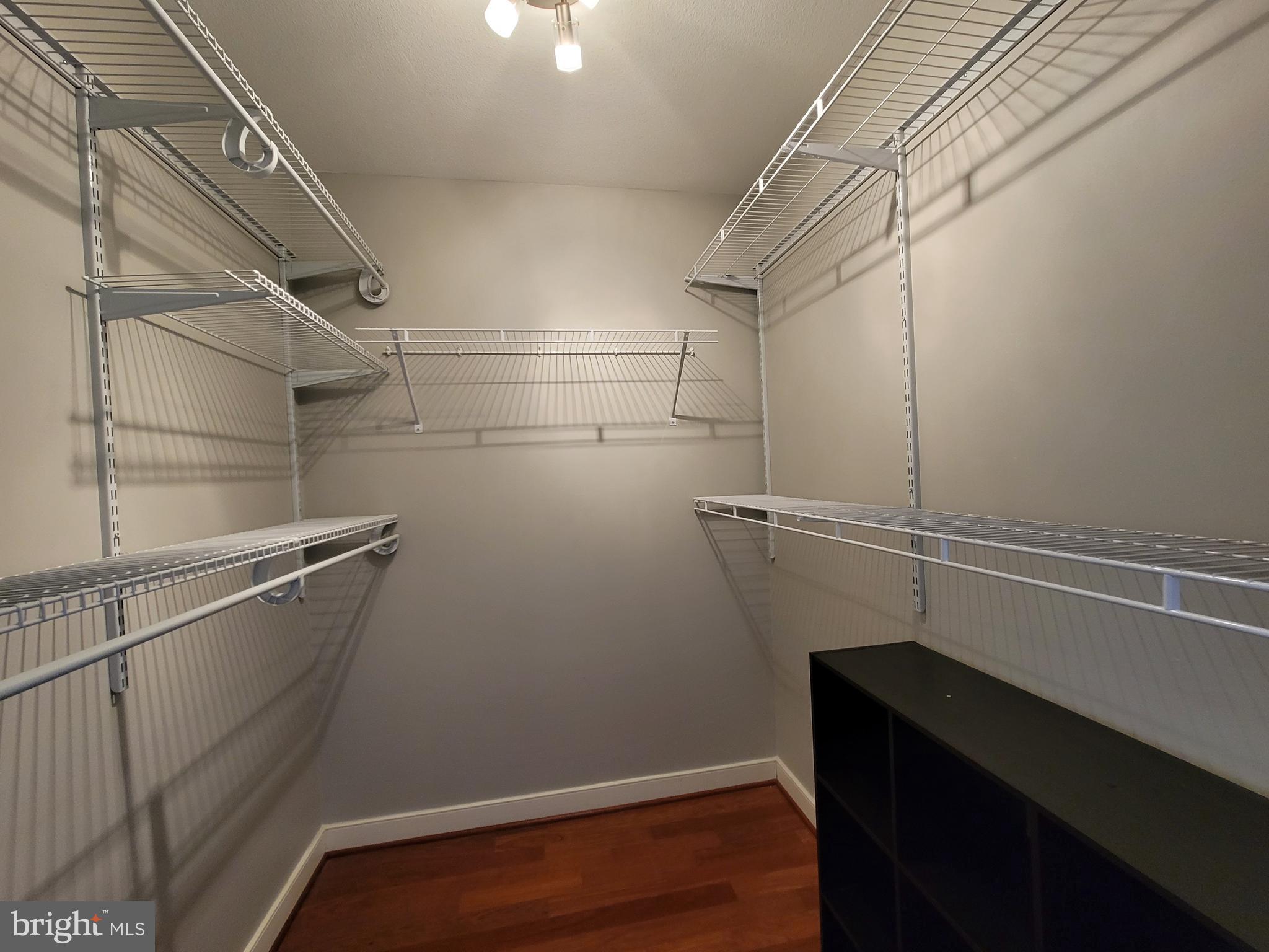 631 D Street Northwest, Unit 1132 Washington, DC 20004 - Photo 25 of 58 a view of a room with racks on the wall