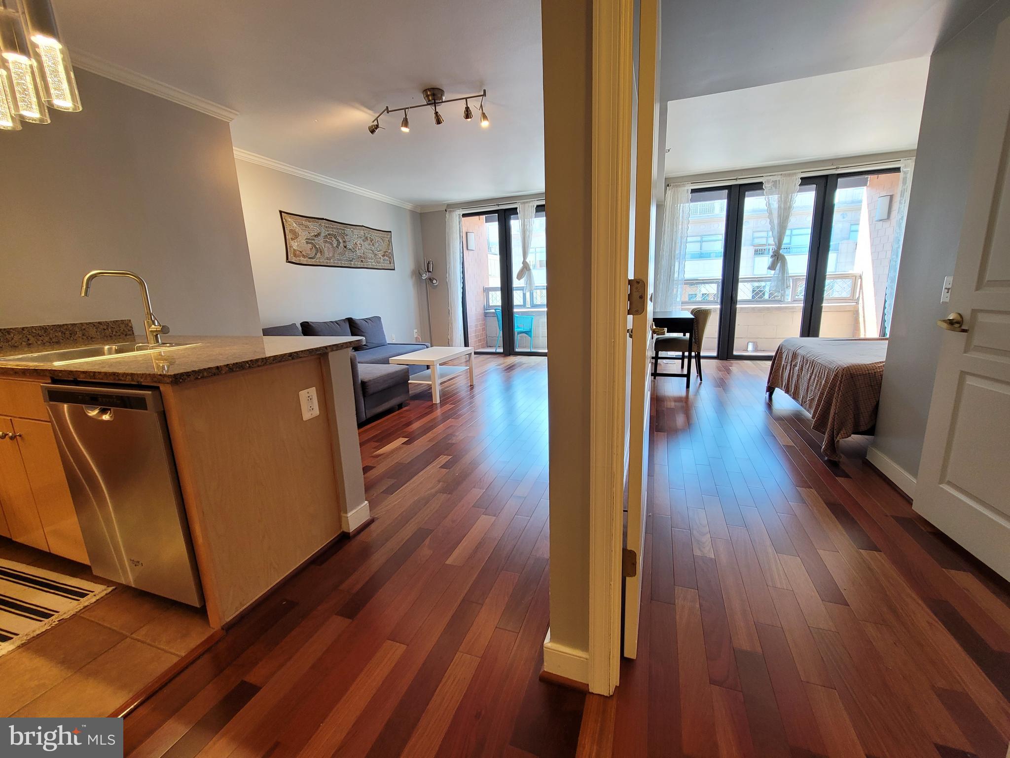 631 D Street Northwest, Unit 1132 Washington, DC 20004 - Photo 6 of 58 a living room with furniture and a wooden floor