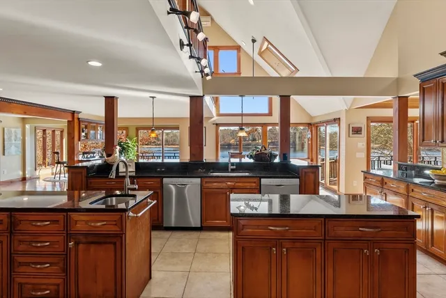 a kitchen with granite countertop a sink and a counter top space