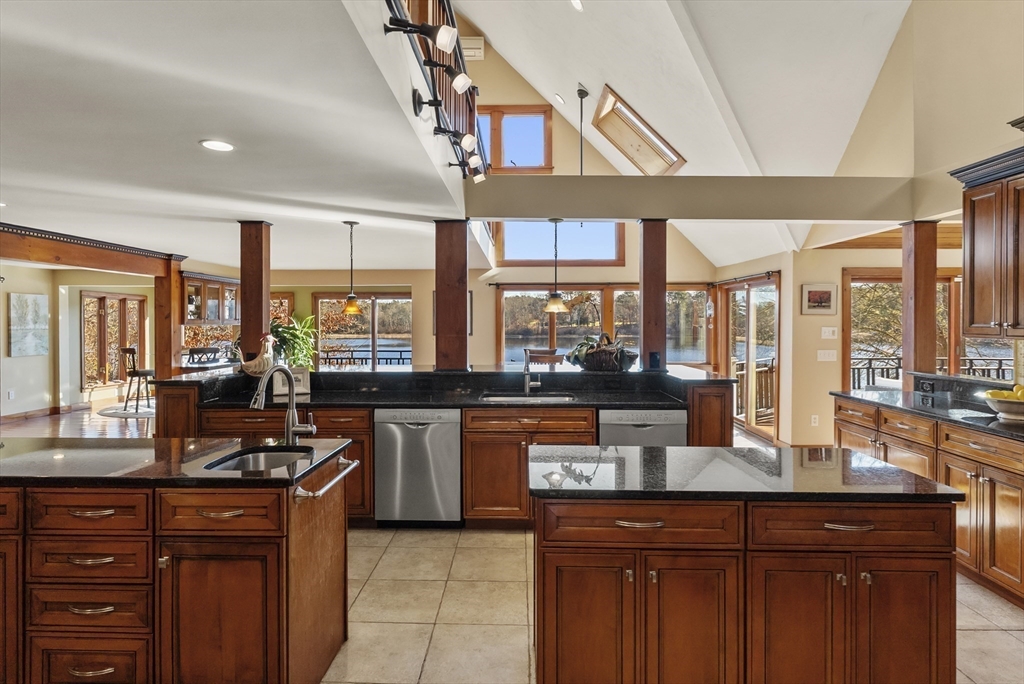 82 Lake Road Plymouth, MA 02360 - Photo 18 of 42 a kitchen with granite countertop a sink and a counter top space