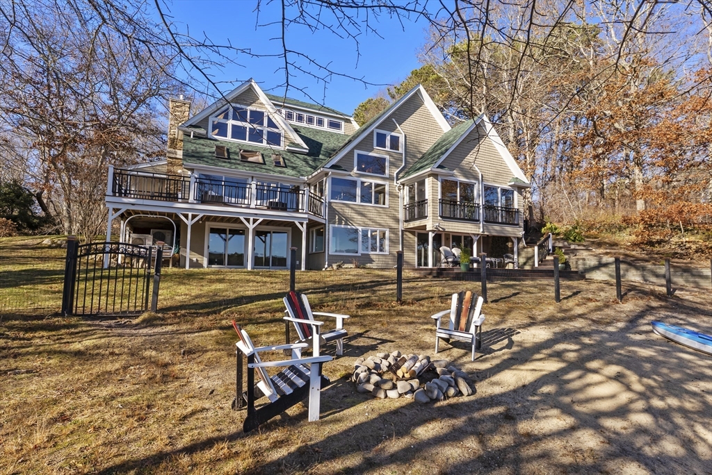 82 Lake Road Plymouth, MA 02360 - Photo 2 of 42 a front view of a house with swimming pool