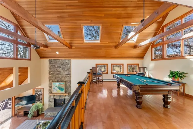 a backyard of a house with barbeque oven table and chairs