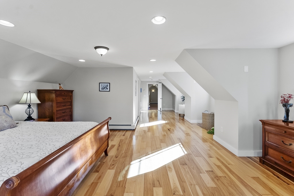 82 Lake Road Plymouth, MA 02360 - Photo 27 of 42 a bed room with a bed and a view of kitchen