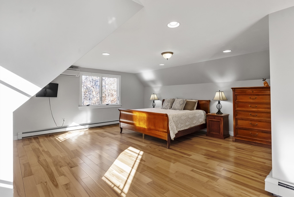 82 Lake Road Plymouth, MA 02360 - Photo 28 of 42 a spacious bedroom with a bed and window