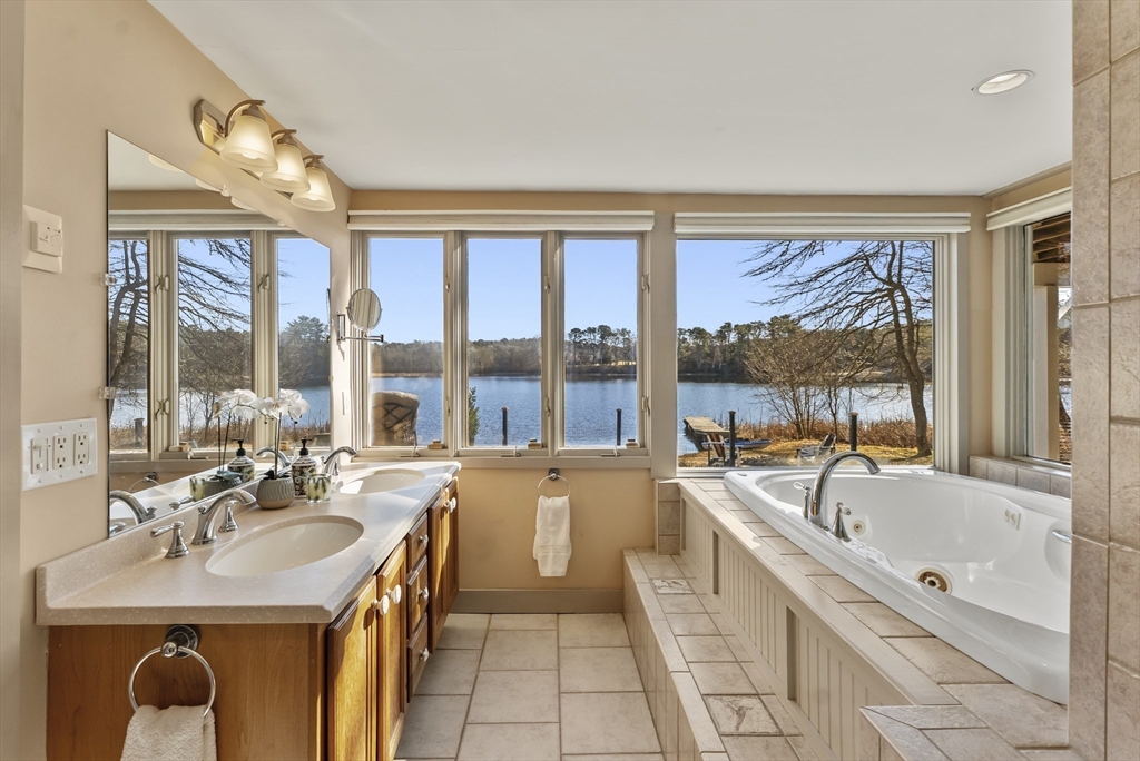 82 Lake Road Plymouth, MA 02360 - Photo 36 of 42 a large white kitchen with a large window and a sink
