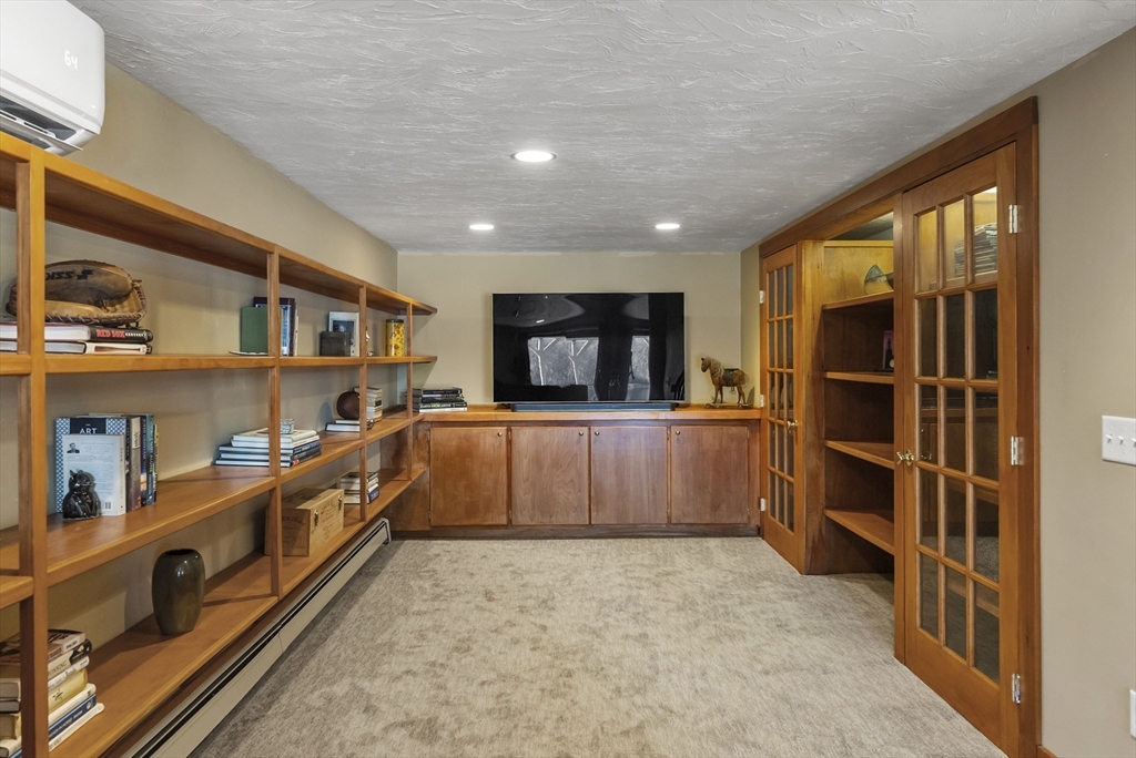 82 Lake Road Plymouth, MA 02360 - Photo 38 of 42 a large kitchen with stainless steel appliances a large counter top and a wooden floors