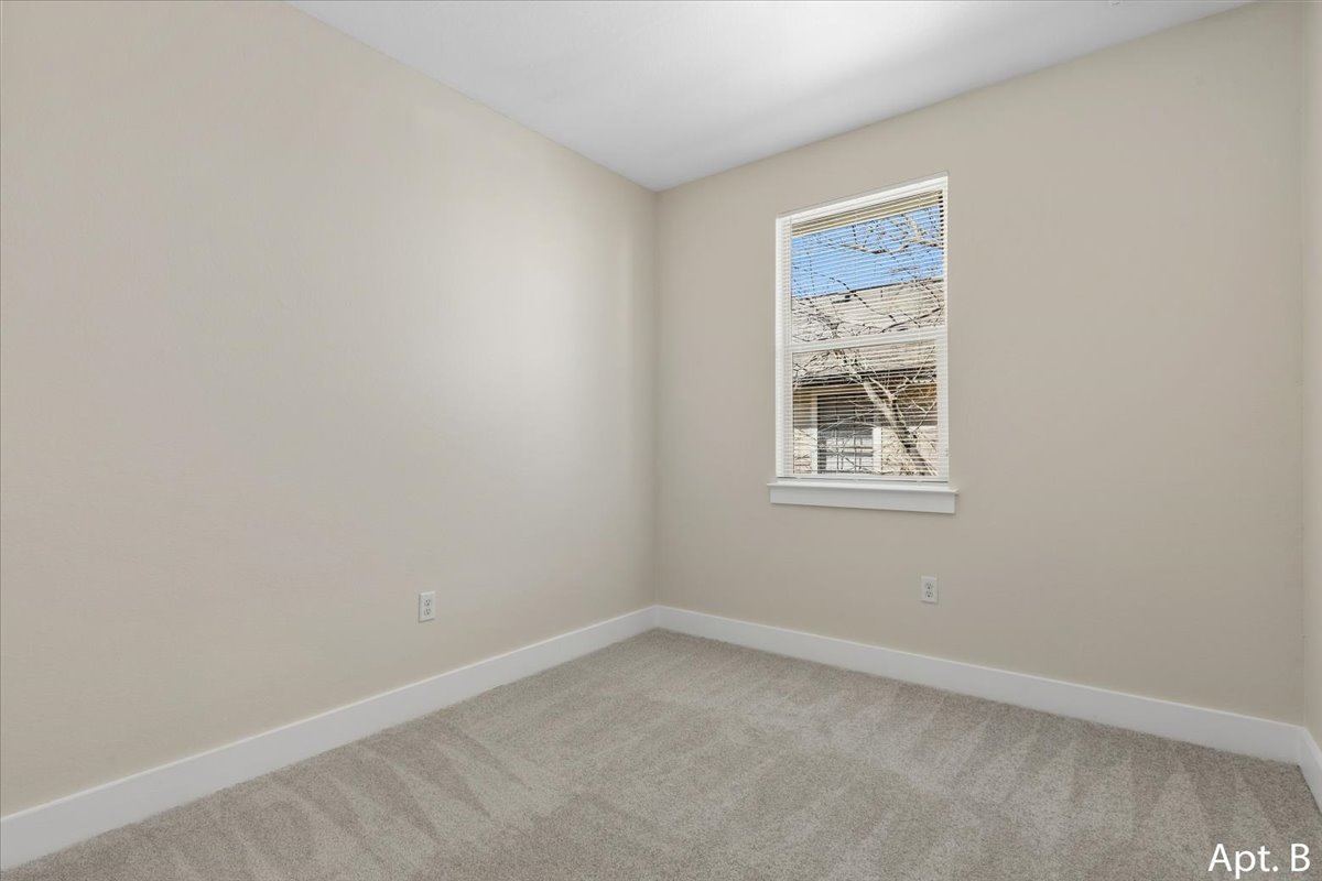2225 Katy Lane, Unit B Georgetown, TX 78626 - Photo 18 of 22 Unfurnished room with baseboards and light colored carpet