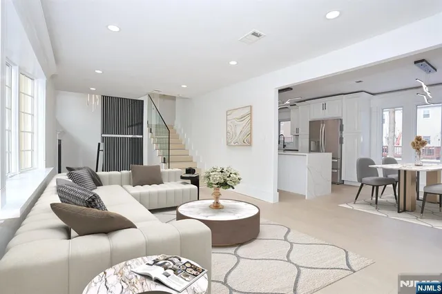 a living room with furniture and a table