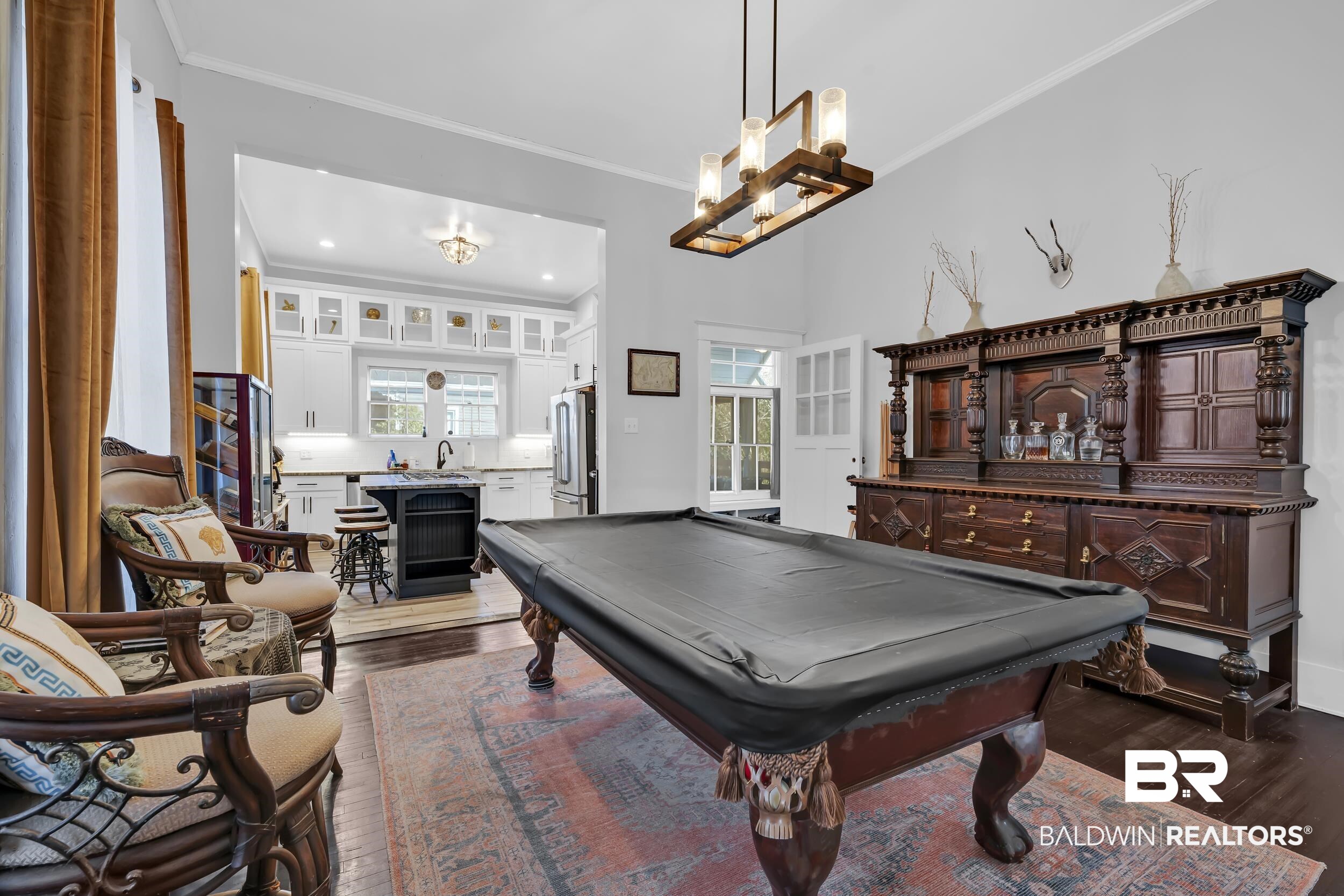 1322 Dauphin Street Mobile, AL 36604 - Photo 10 of 21 Recreation room with ornamental molding, dark wood-style flooring, billiards table, and hanging lights
